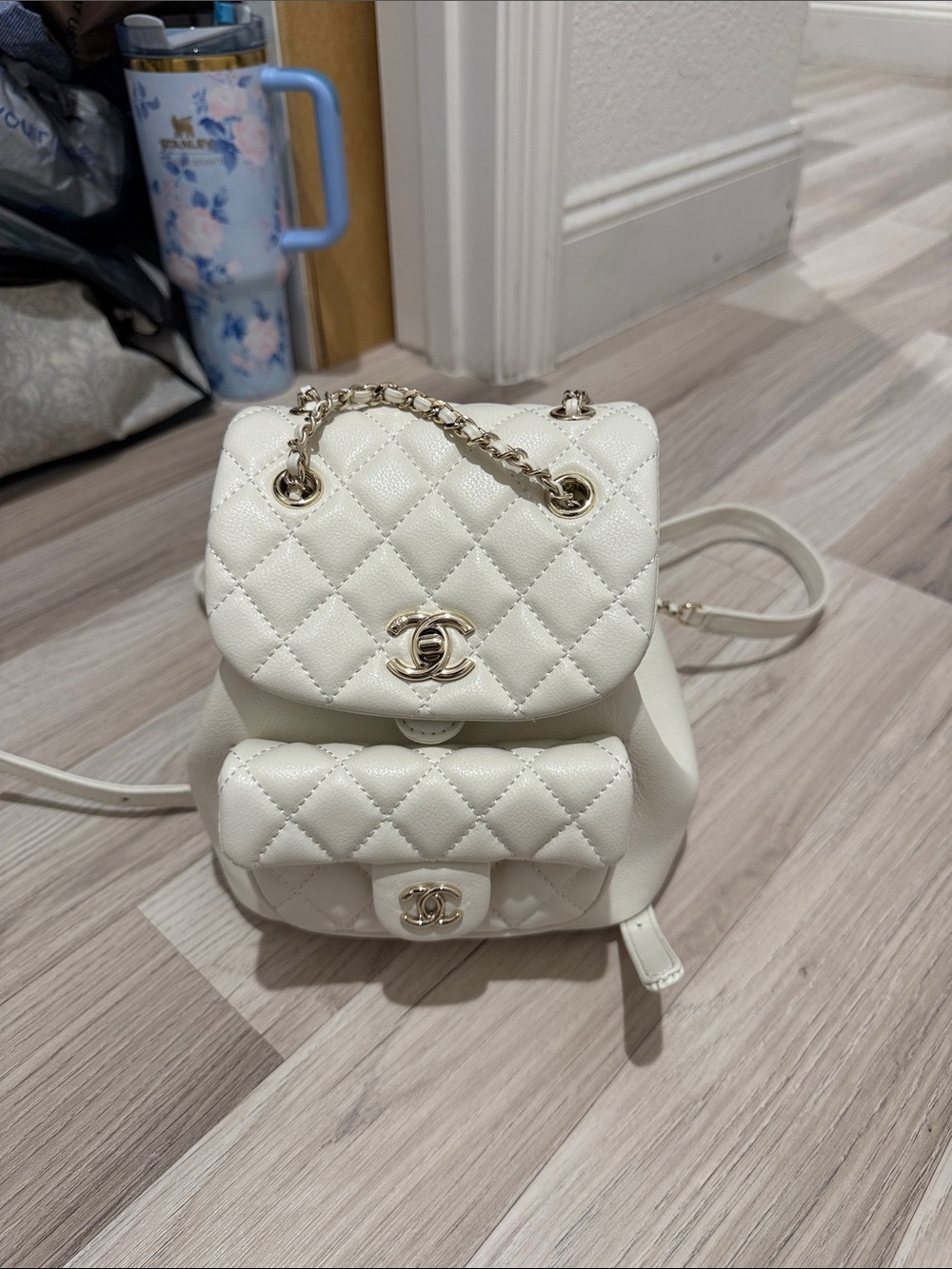 CHANEL Quilted Cream Mini Backpack with Gold Chain and CC Logo